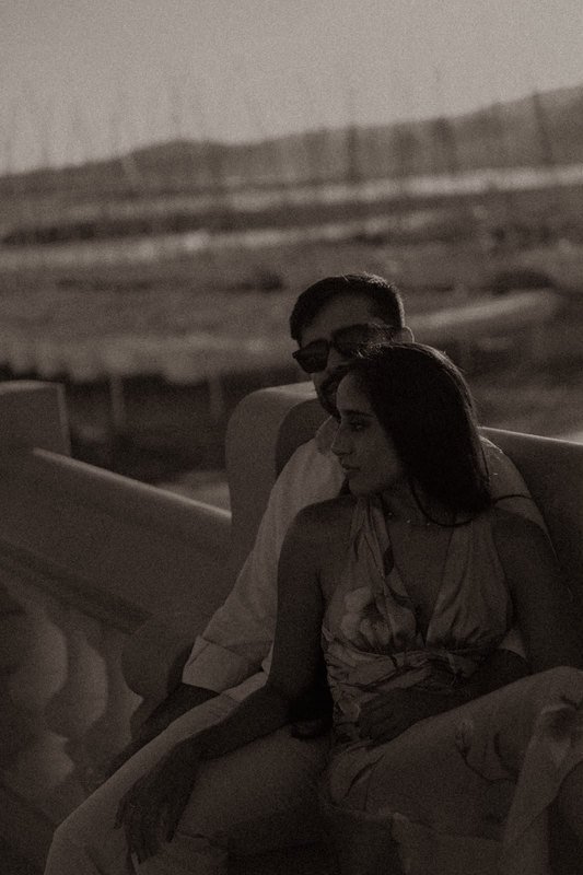 Sindhu and Amish sitting together by the sea