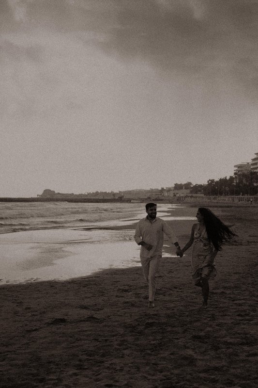 Sindhu and Amish running along the beach