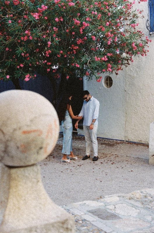 Sindhu and Amish under a flowering tree